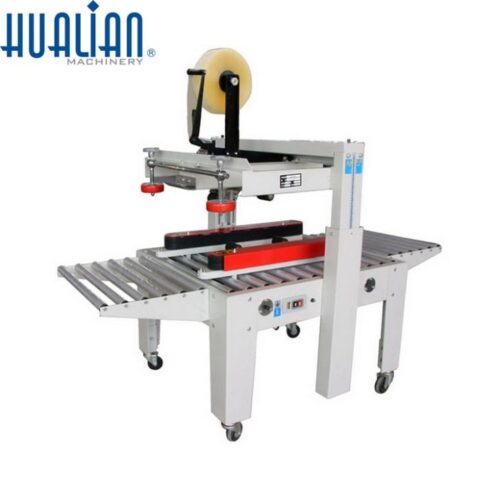 Máquina cerradora de cajas de cartón pesado
